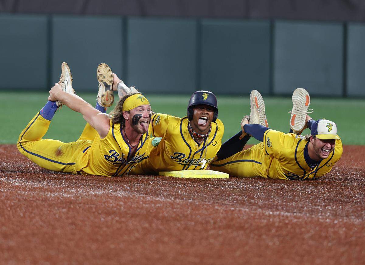 Members of the Savannah Bananas celebrate after getting a homerun Friday, June 6, 2025 at Banana Ball against the Party Animals at Bank of America Stadium in Charlotte.