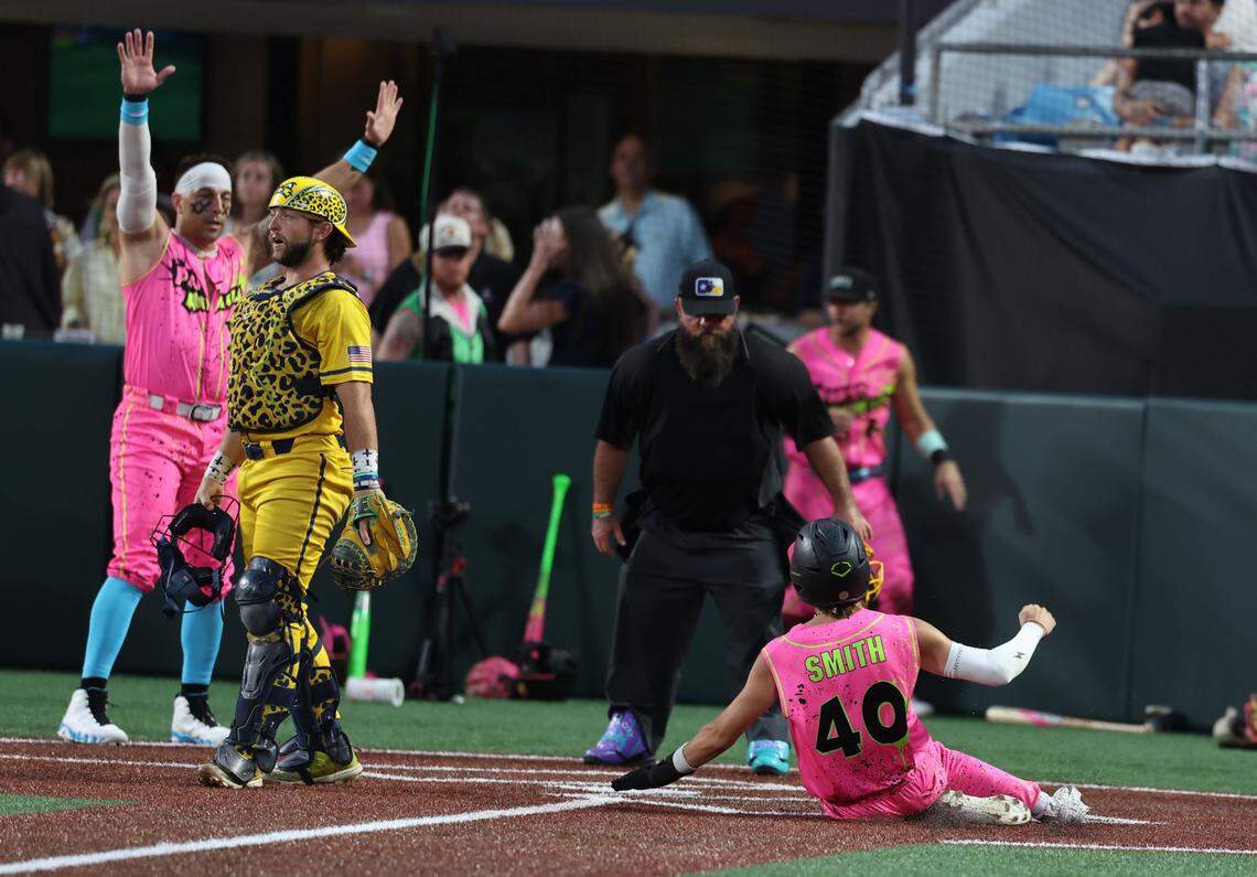Party Animals’ Mark Smith slides into home Friday, June 6, 2025 at Banana Ball at Bank of America Stadium in Charlotte.