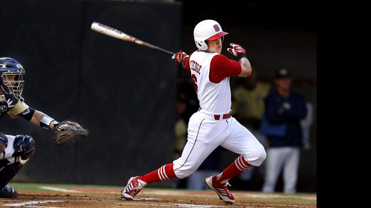 
N.C. State's Logan Ratledge (6) hits during N.C. State's game against Georgia Tech at Doak Field in Raleigh, N.C., Friday, April 25, 2014.
