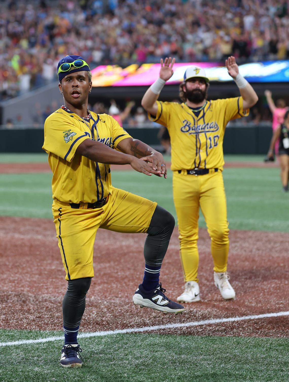 Bananas’ Ty Jackson, left, and Alex Ziegler dance Friday, June 6, 2025 at Bank of America Stadium.