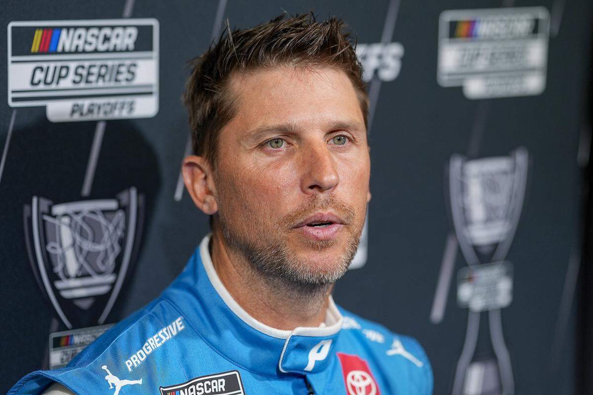 Denny Hamlin answers questions from the media during NASCAR Cup Series Playoff media day on Aug. 27, 2025, at the Charlotte Convention Center.