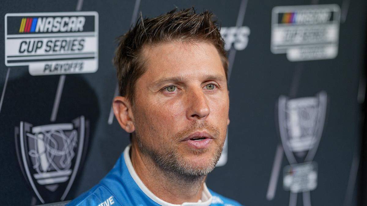 Aug 27, 2025; Charlotte, NC, USA; Denny Hamlin answers questions from the media during NASCAR Cup Series Playoff Media Day at Charlotte Convention Center.