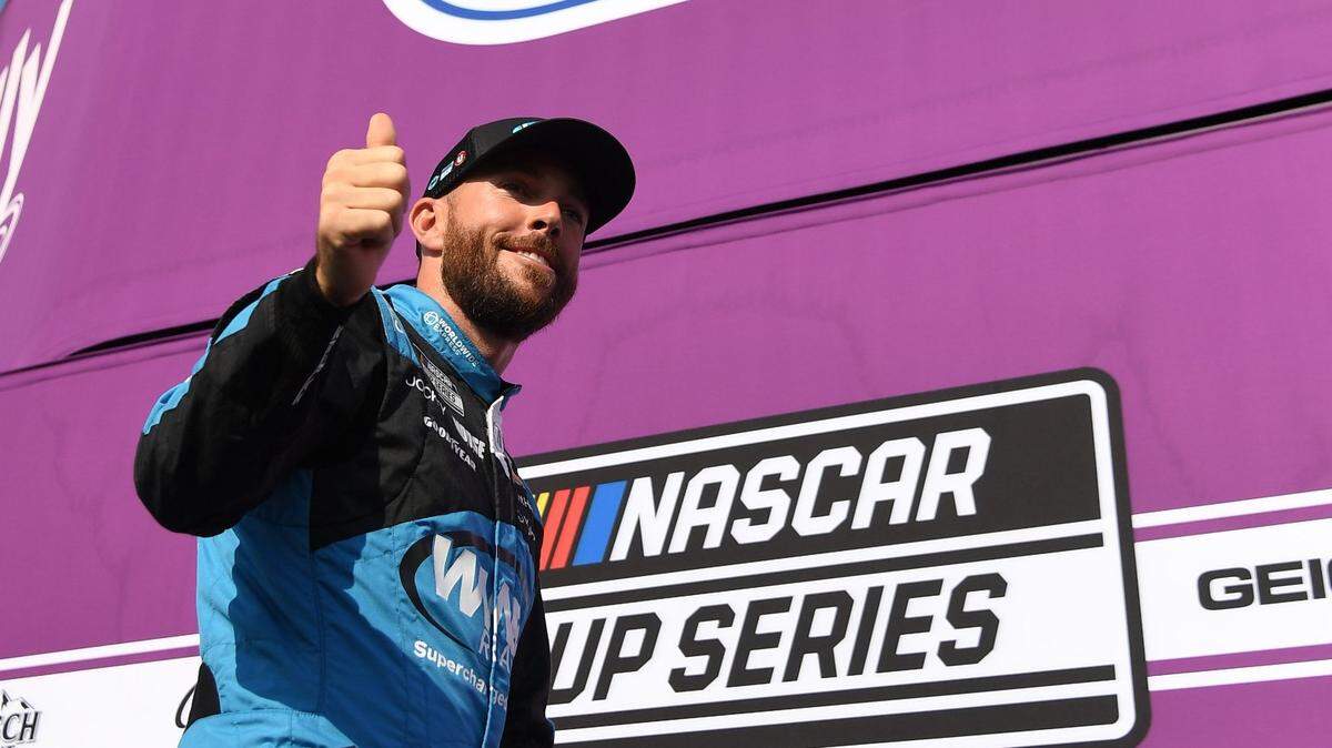 Jun 25, 2023; Nashville, Tennessee, USA; NASCAR Cup Series driver Ross Chastain (1) crosses the stage during driver introductions before the Ally 400 at Nashville Superspeedway. Mandatory Credit: Christopher Hanewinckel-USA TODAY Sports