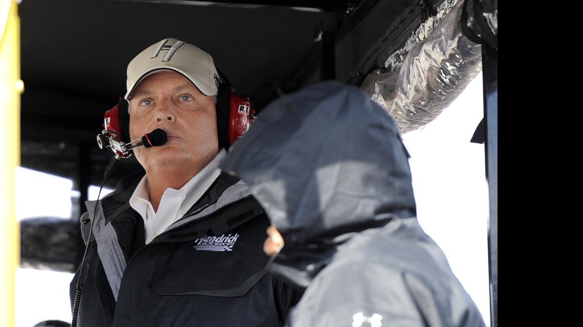 
Rick Hendrix, owner of Hendrix Motorsports, watches the final laps of a 2014 NASCAR Sprint Cup Series auto race at Martinsville Speedway. 
