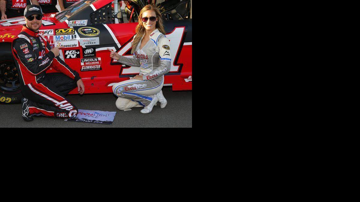 
 Kurt Busch poses for a photo with Miss Coors Light Rachel Rupert after winning the pole during qualifying for the NASCAR Sprint Cup Series Auto Club 400 at Auto Club Speedway on March 20 in Fontana, Cal.

