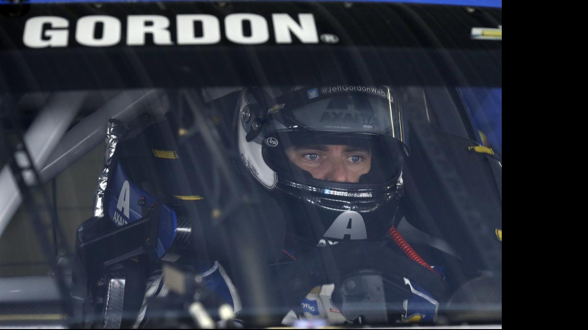 
Jeff Gordon (24) waits in his race car at Pocono Raceway during practice for Sunday's NASCAR Sprint Cup Series auto race in Long Pond, Pa., Saturday, June 6, 2015. 
