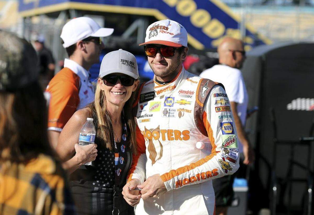 “I’m going to race guys how they race me and keep a smile on my face regardless,” Chase Elliott, at right posing with a fan for a photo, said after Sunday’s Cup Series race at Phoenix International Raceway. Elliott contributed to a wreck Sunday that knocked out Denny Hamlin, who had intentionally wrecked him two weeks ago.