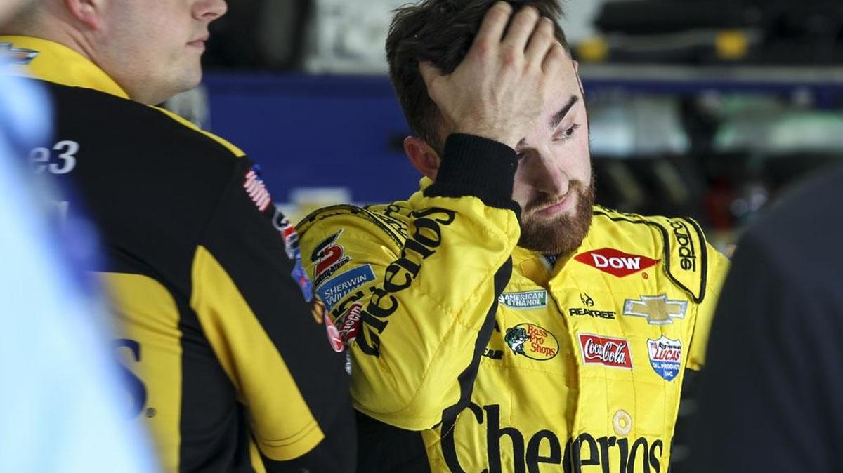 
Austin Dillon rubs his forehead as he watches his car being worked on during Saturday
s practice for Sunday's NASCAR Sprint Cup series auto race, the Sylvania 300, at New Hampshire Motor Speedway in Loudon, N.H., Saturday, 
