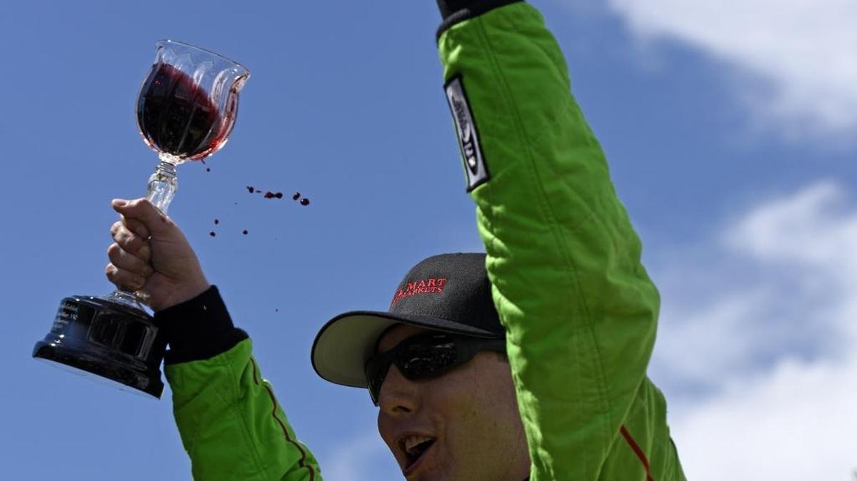 Kyle Busch celebrates in Victory Lane after winning during the NASCAR Sprint Cup Series Toyota/Save Mart 350 at Sonoma Raceway on June 28.