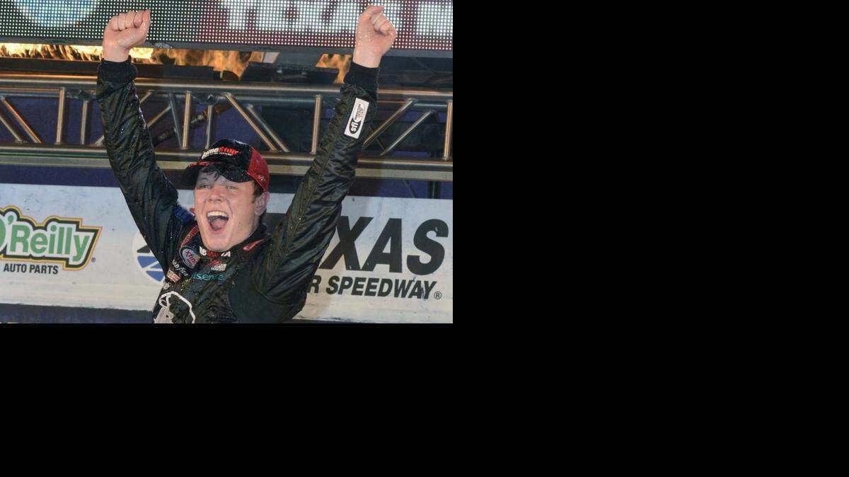 
Erik Jones (20) celebrates winning the NASCAR Xfinity series auto race at Texas Motor Speedway in Fort Worth, Texas, Friday, April 10, 2015. (AP Photo/Larry Papke)

