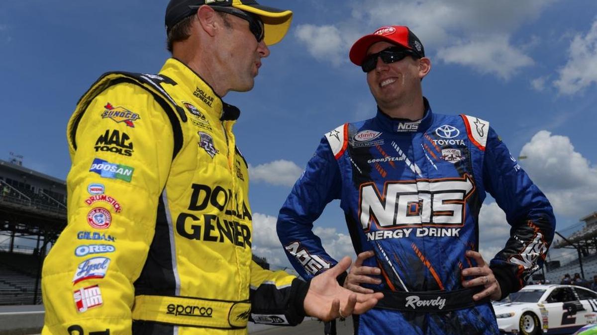 Matt Kenseth, left, talks to Kyle Busch during Saturday’s qualifying for Sunday’s Brickyard 400 at Indianapolis Motor Speedway.