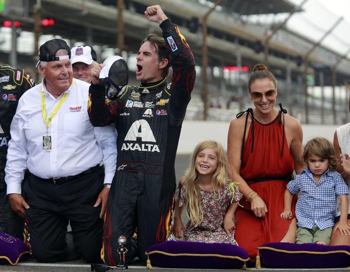 Jeff Gordon, now a broadcaster, celebrates after winning the NASCAR Brickyard 400 auto race at Indianapolis Motor Speedway in 2014. At left is team owner Rick Hendrick. At right are Gordon's wife, Ingrid Vandebosch, and their children, Ella Sofia and Leo Benjamin.