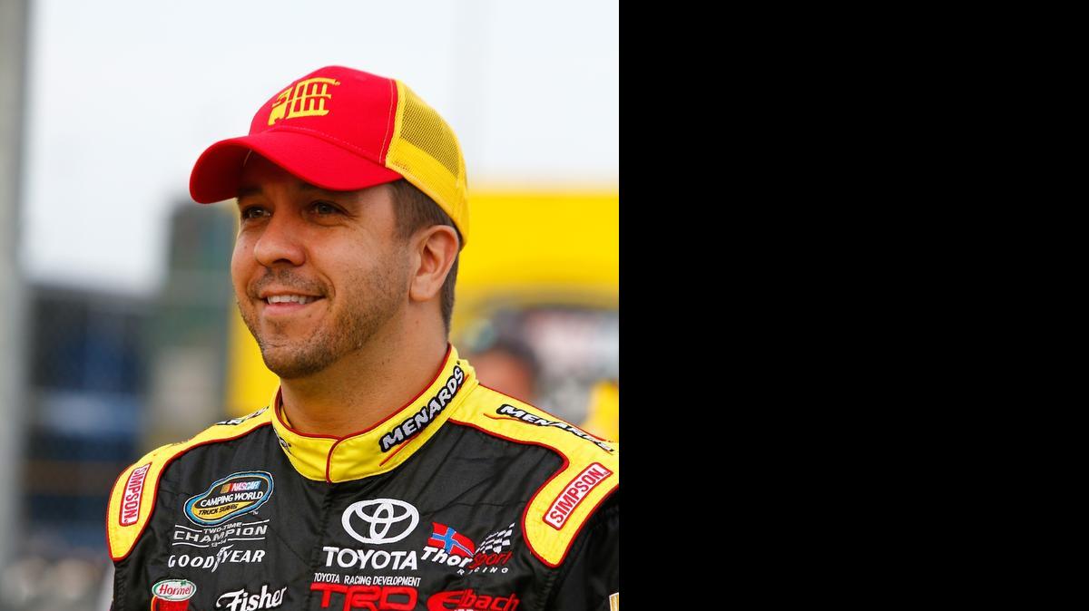 
KANSAS CITY, KS - MAY 08: Matt Crafton, driver of the #88 Slim Jim/Menards Toyota, looks on prior to the NASCAR Camping World Truck Series Toyota Tundra 250 at Kansas Speedway on May 8, 2015 in Kansas City, Kansas. (Photo by Jerry Markland/Getty Images) 
