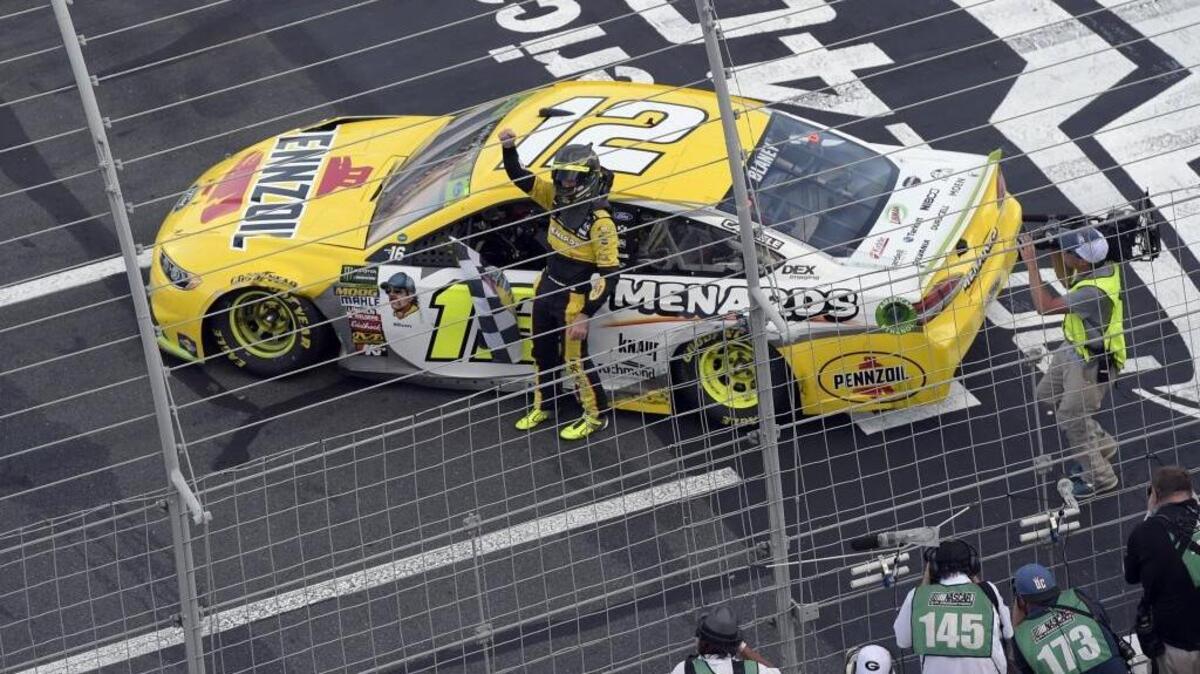 Ryan Blaney celebrates after winning the NASCAR Cup series race at Charlotte Motor Speedway in Concord on Sunday