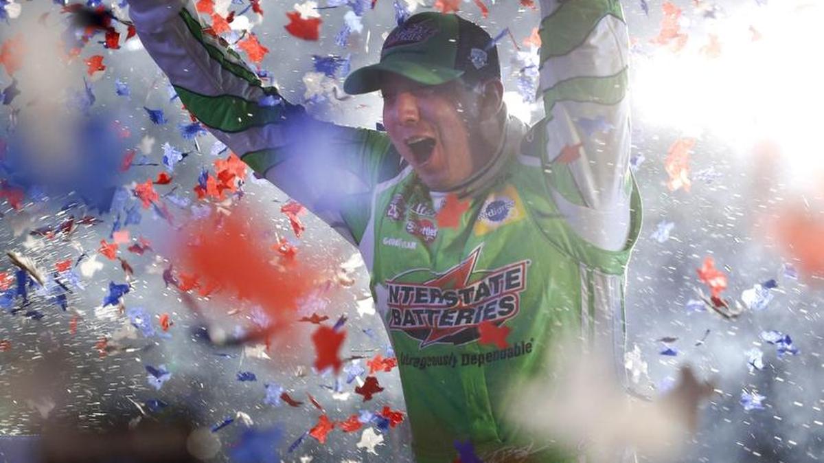 Kyle Busch celebrates after winning the NASCAR Sprint Cup Series auto race at Texas Motor Speedway in Fort Worth, Texas, early Sunday, April 10, 2016.