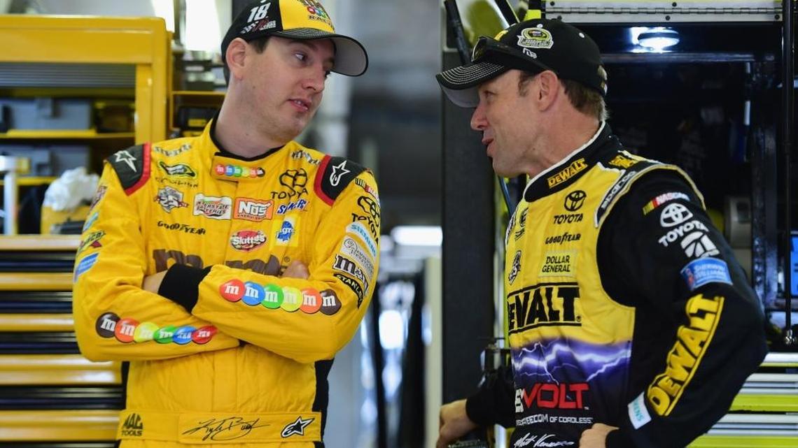 Joe Gibbs Racing drivers Kyle Busch (left) and Matt Kenseth talk during practice Friday at Texas Motor Speedway.