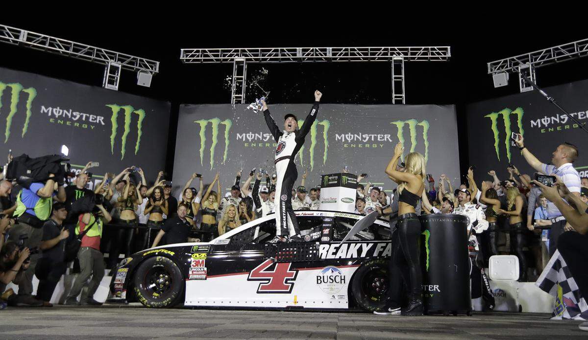 Kevin Harvick celebrates in Victory Lane after winning the NASCAR All-Star auto race at Charlotte Motor Speedway.