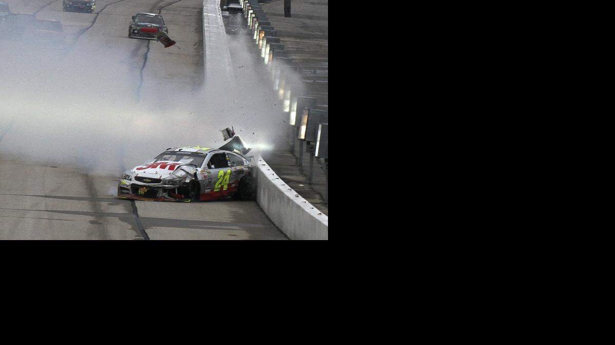 
Jeff Gordon (24) hits the wall on Sunday during the NASCAR Sprint Cup series  race at Atlanta Motor Speedway in Hampton, Ga. The accident left Gordon with a 41st-place finish for the race. 
