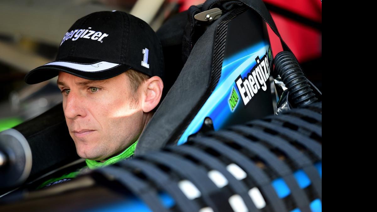 
Jamie McMurray, in his car in the garage during practice last week at Richmond, has moved up to ninth in the Sprint Cup Series.
