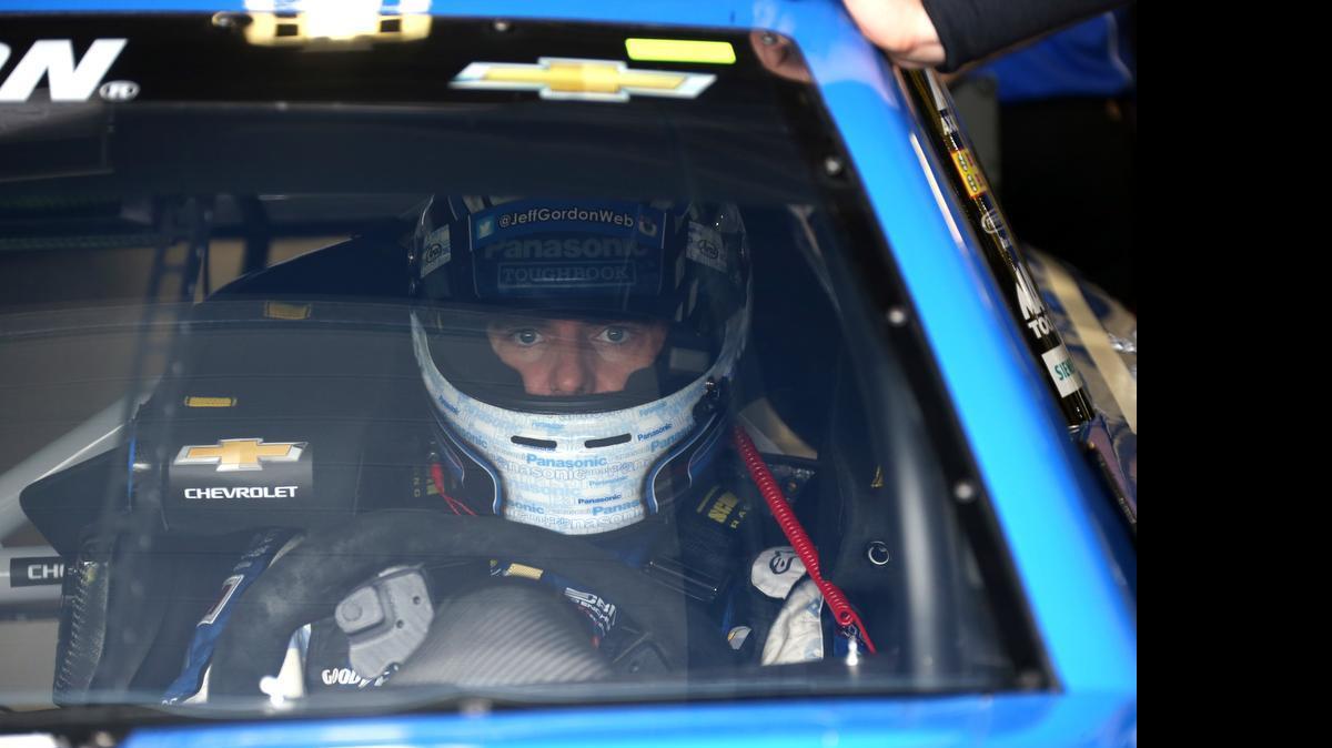 
Jeff Gordon is seen in his car before practicing for Sunday's NASCAR Sprint Cup series auto race at Michigan International Speedway, Friday, June 12, 2015, in Brooklyn, Mich. 
