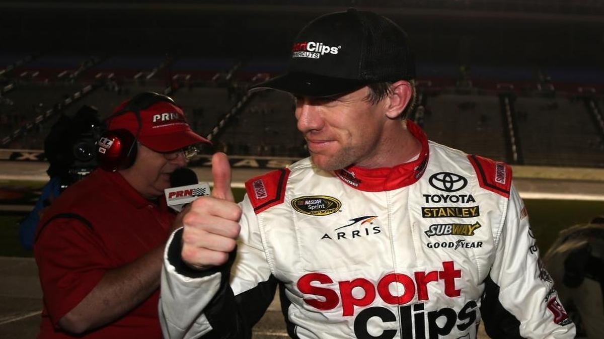 Carl Edwards celebrates winning Sunday’s rain-shortened NASCAR Sprint Cup Series AAA Texas 500 at Texas Motor Speedway.