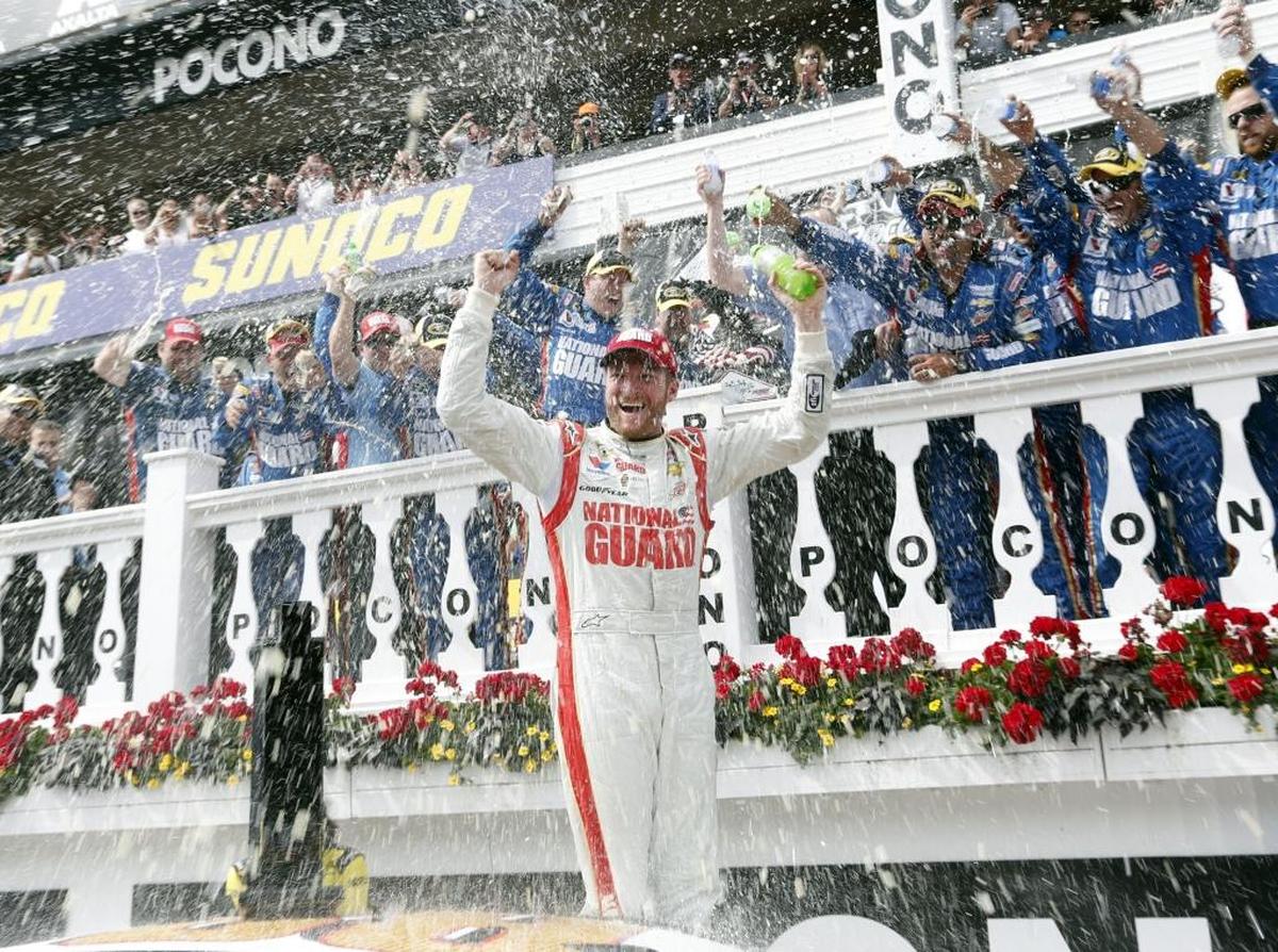 Dale Earnhardt Jr. celebrates after winning the NASCAR Cup Series auto race at Pocono Raceway on June 8, 2014. Earnhardt hopes to pick up his third win at the track this weekend.
