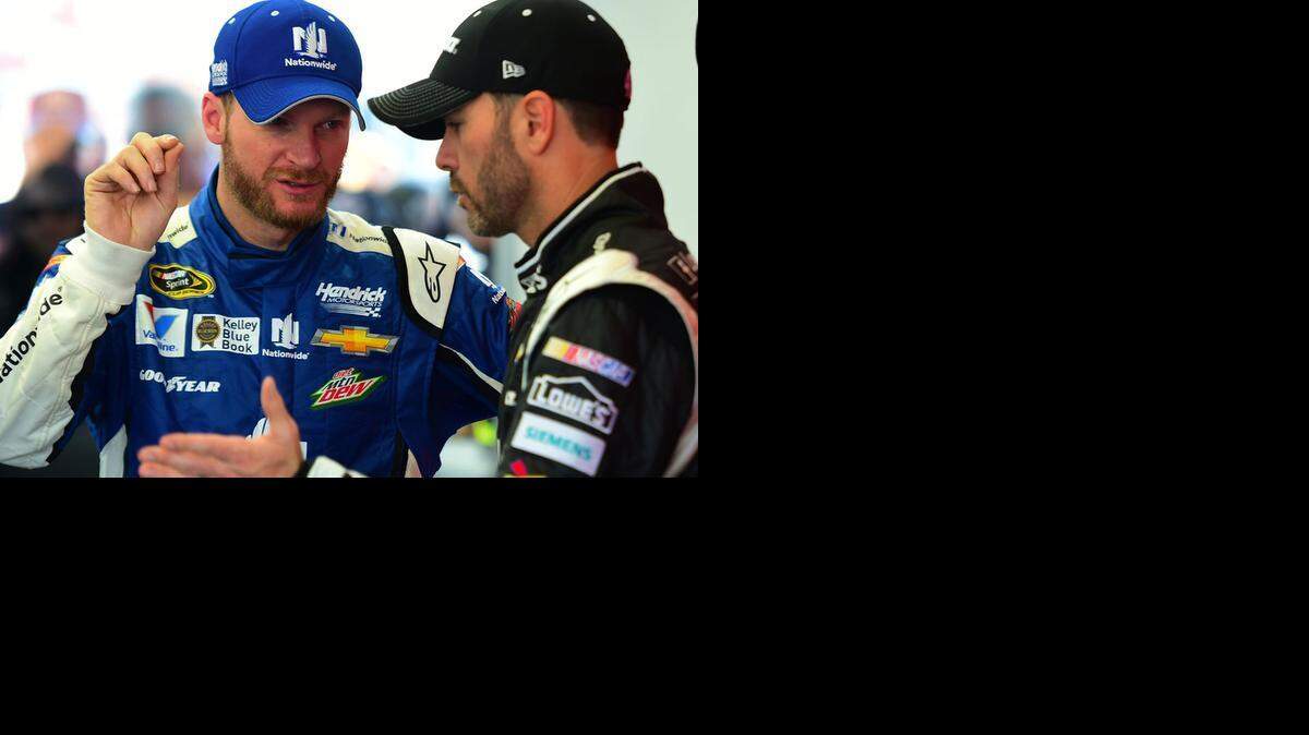 
Dale Earnhardt Jr., left, speaks with Jimmie Johnson in the garage at Las Vegas Motor Speedway on Saturday, March 7, 2015.
