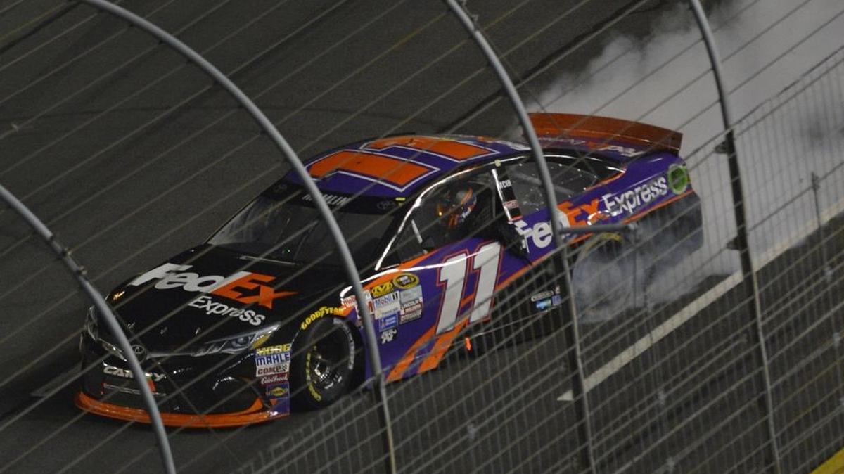 Denny Hamlin does a burnout after winning the 2015 Sprint All-Star Race at Charlotte Motor Speedway.