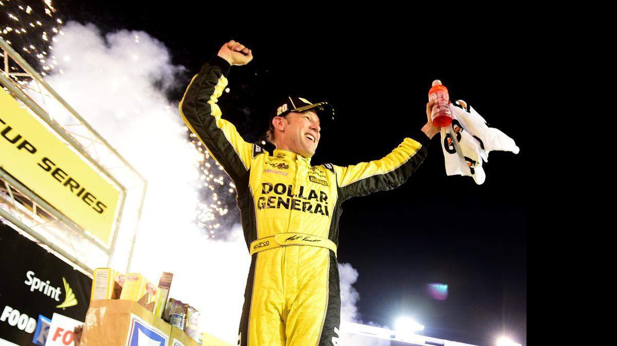 
Matt Kenseth celebrates in Victory Lane after winning the NASCAR Sprint Cup Series Food City 500 at Bristol Motor Speedway. 
