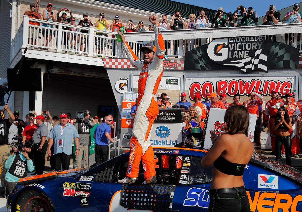 Chase Elliott, center, celebrates after winning a NASCAR Cup Series auto race, Sunday, Aug. 5, 2018, in Watkins Glen, N.Y. (AP Photo/Julie Jacobson)