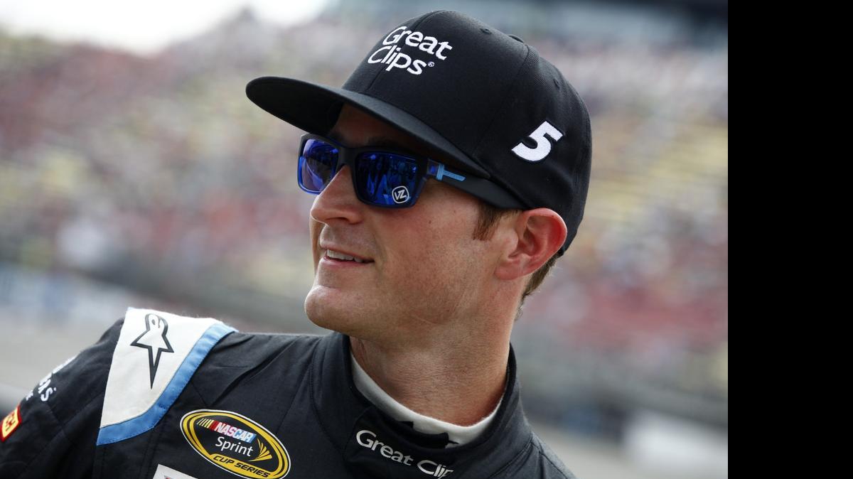 
Kasey Kahne stands on the grid after Friday’s qualifying on the pole for Sunday’s NASCAR Sprint Cup Series Quicken Loans 400 at Michigan International Speedway in Brooklyn, Mich.
