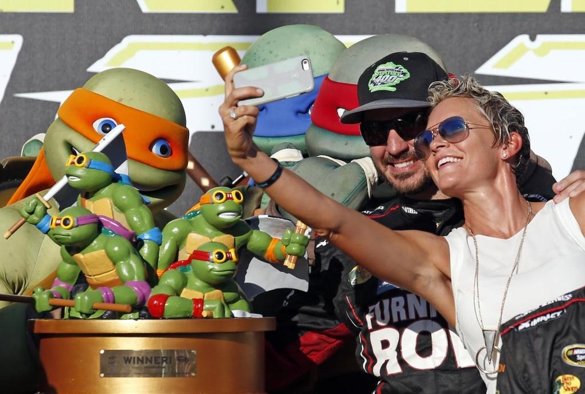 NASCAR Cup Series regular season champion Martin Truex Jr., left, has been too good too often this season to not rank among the playoffs favorites. Above, Truex and his girlfriend, Sherry Pollex, pose for photos after winning the 2016 playoffs opener at Chicagoland Speedway.