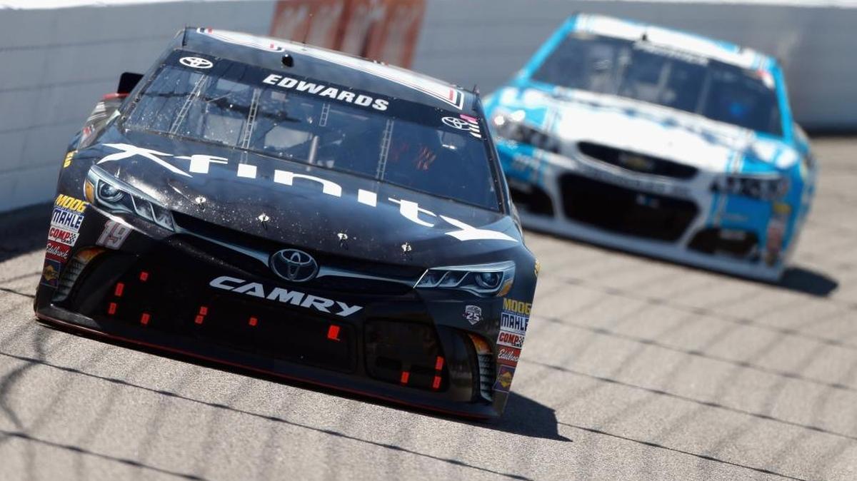 Carl Edwards, left, in his Toyota races Danica Patrick, in her Chevrolet during the Toyota Owners 400 at Richmond International Raceway in Richmond, Va., on Sunday.