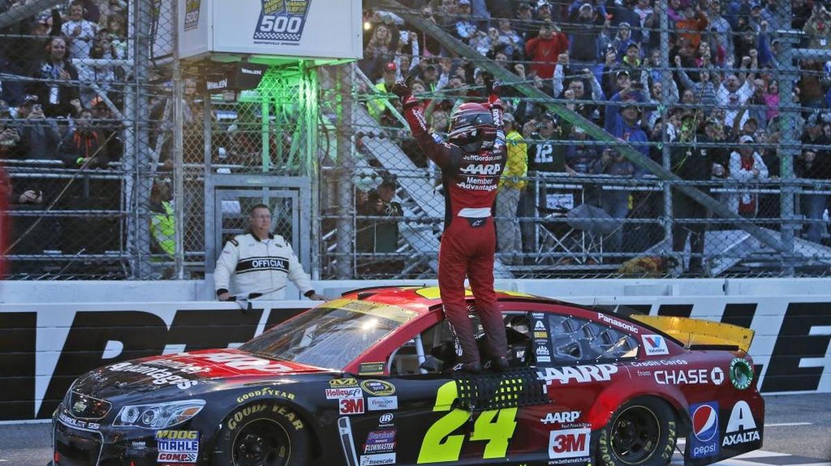 Jeff Gordon celebrates with the crowd at Martinsville, Va., after winning there on Nov. 1 and clinching a spot in the Chase championship round at Homestead, Fla.