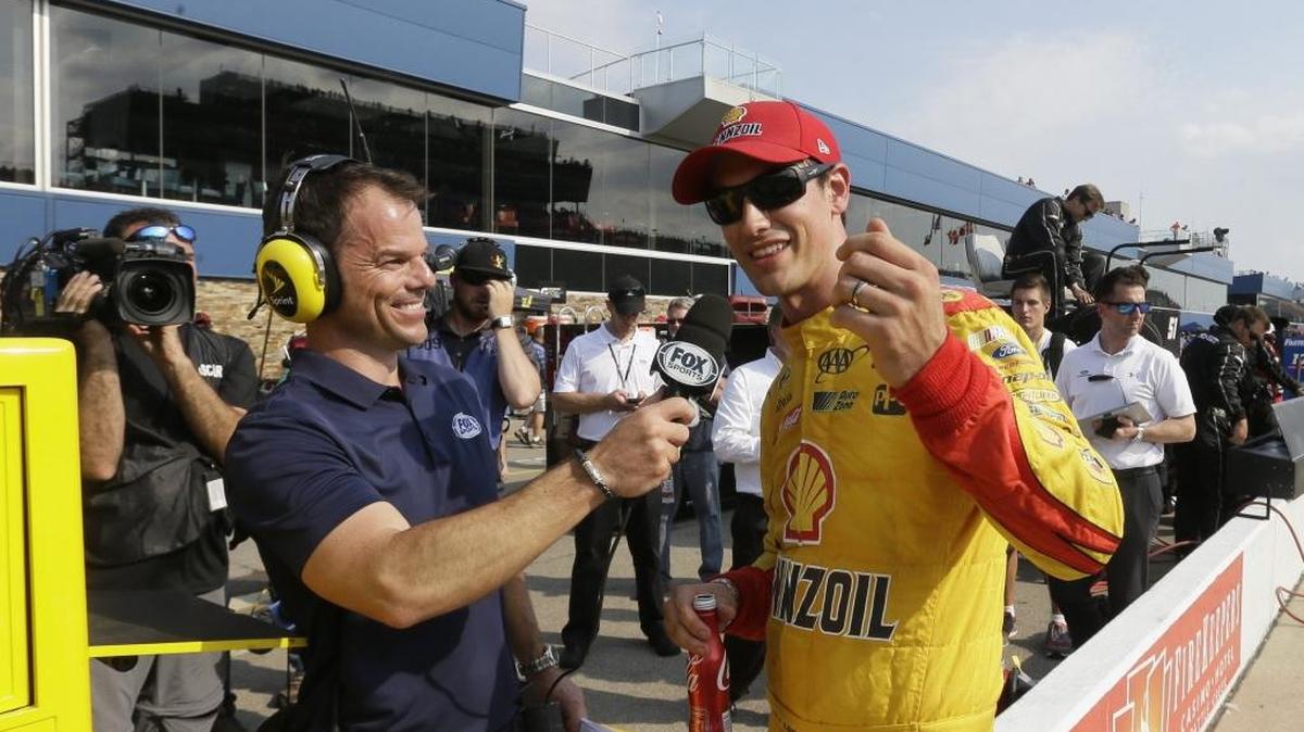Driver Joey Logano is interviewed after winning the pole for the NASCAR Sprint Cup series auto race at Michigan International Speedway on Friday in Brooklyn, Mich.