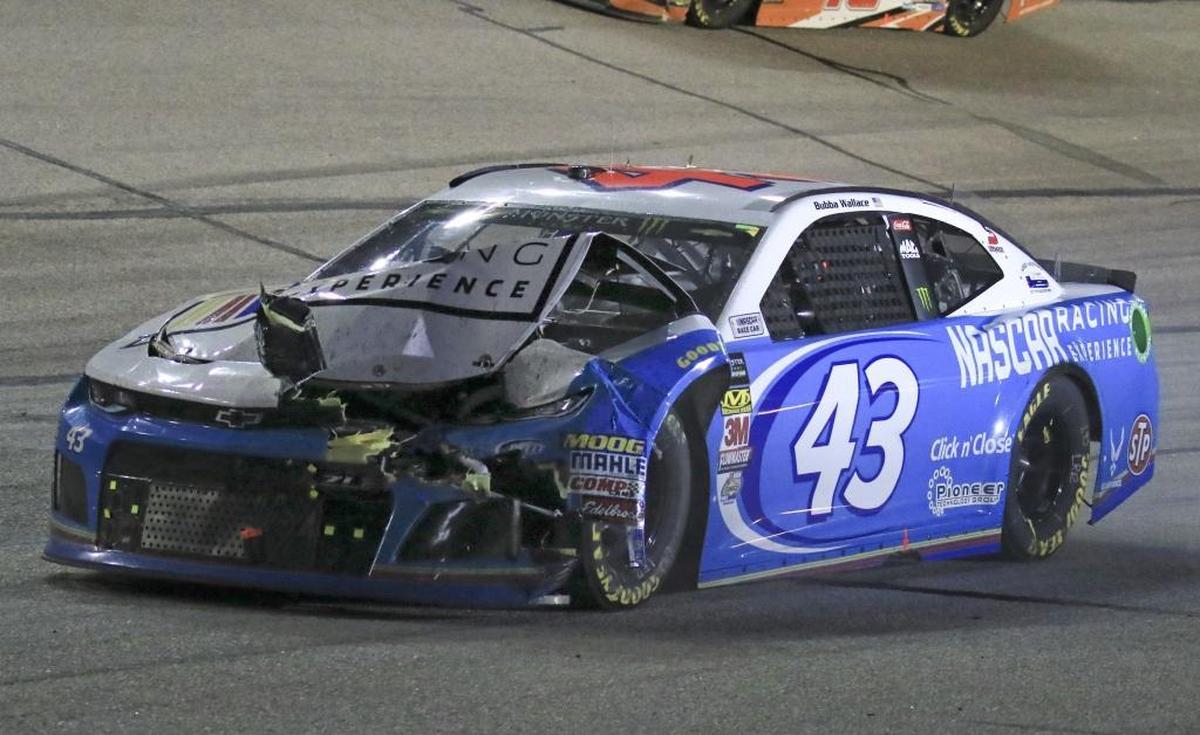 Darrell Wallace Jr. (43) guides his damaged car to the pits after being involved in a crash in Sunday’s race at Atlanta Motor Speedway.