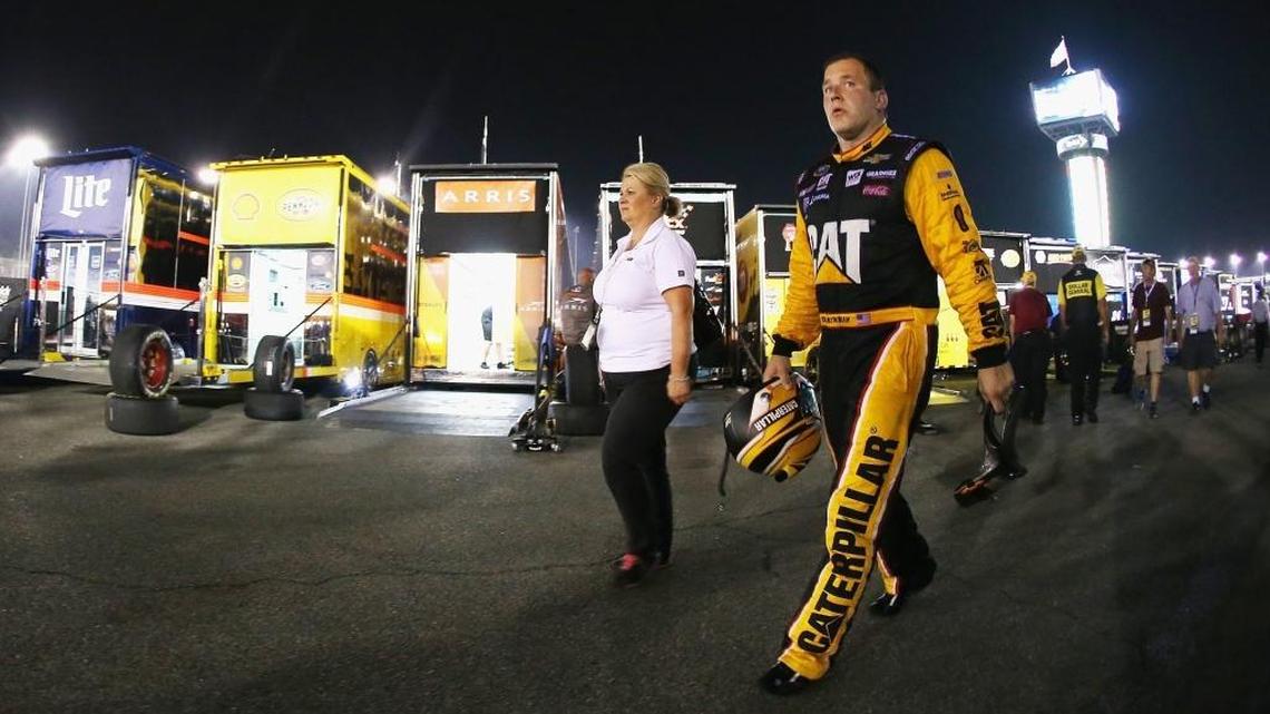 Ryan Newman (right) walks through the garage at Richmond International Raceway after he wrecked with Tony Stewart on Saturday night.