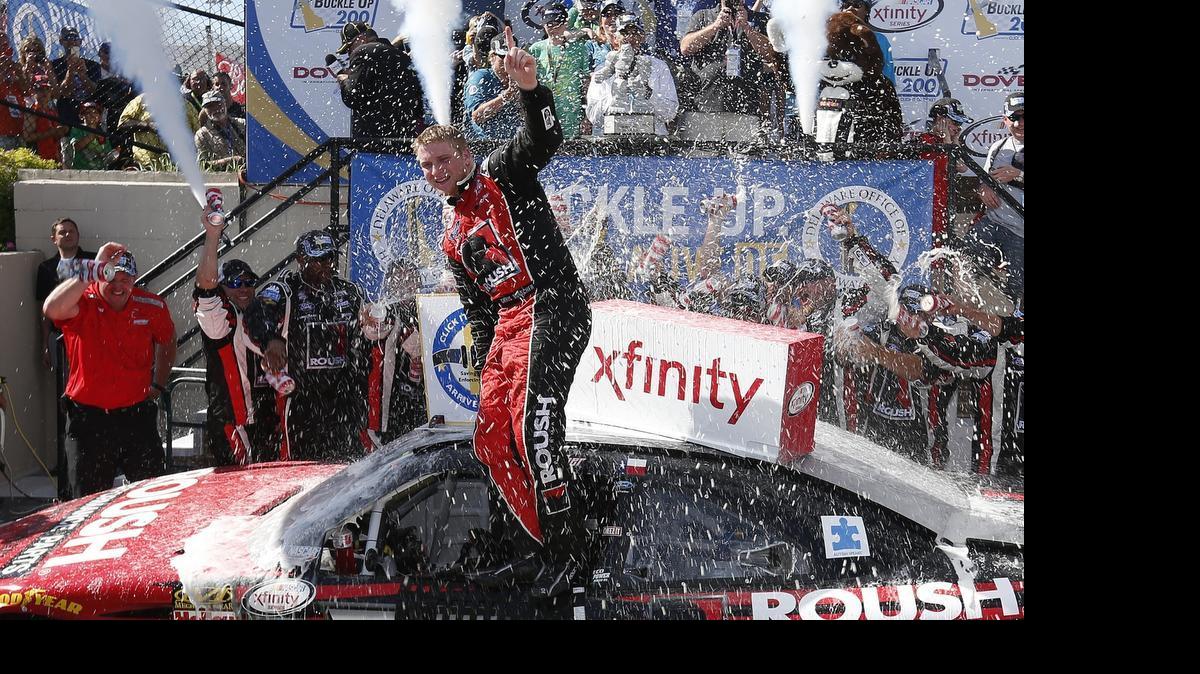 
Chris Buescher celebrates in Victory Lane after winning the NASCAR XFINITY Series Buckle Up 200 presented by Click It or Ticket at Dover International Speedway on May 30, 2015 in Dover, Del.
