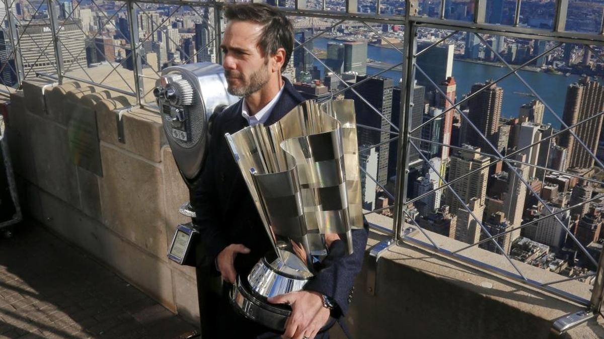 Jimmie Johnson poses holding his 2016 NASCAR Sprint Cup Series Champion trophy during his visit to the Empire State Building on Nov. 22. For the seventh time, he is atop the NASCAR world.