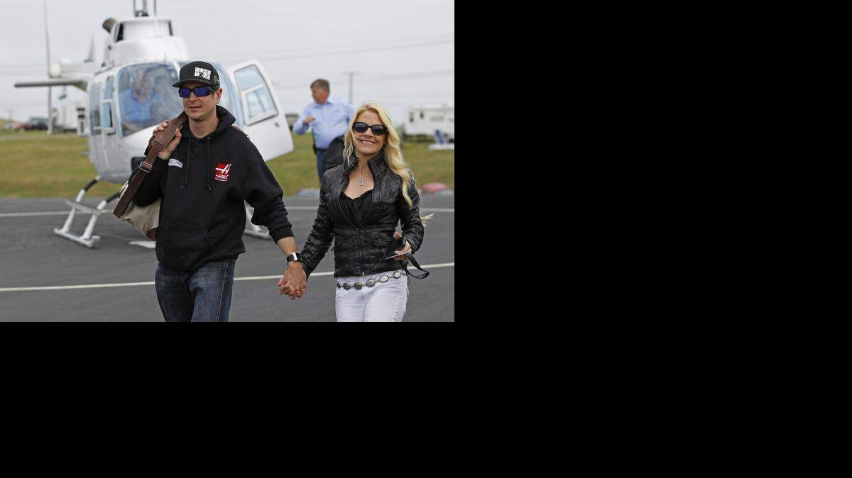 
Kurt Busch walks with his then-girlfriend, Patricia Driscoll, after arriving for the NASCAR Sprint All-Star auto race May 17, 2014, at Charlotte Motor Speedway.
