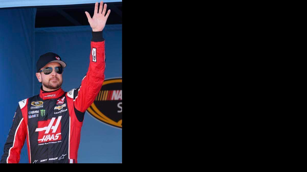 
Kurt Busch waves to fans before a NASCAR Sprint Cup Series auto race on Sunday, March 15, 2015, in Avondale, Ariz. 
