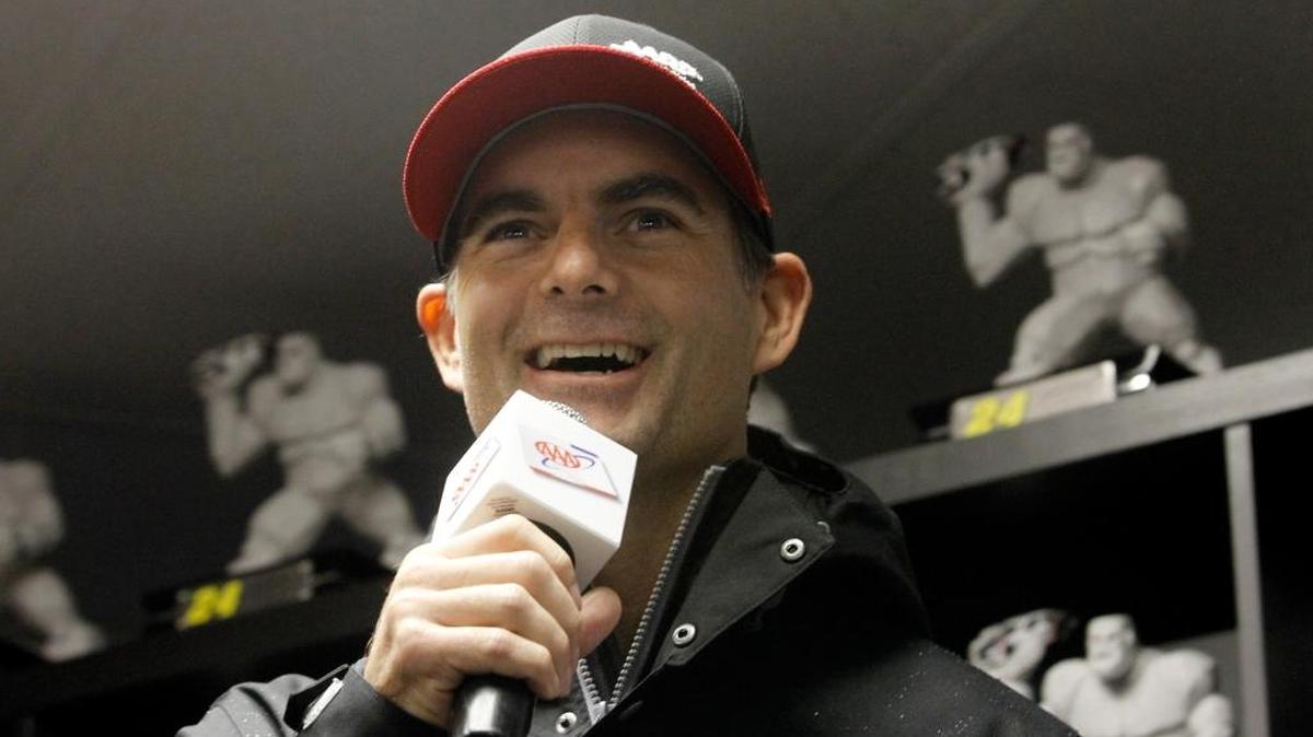 
Jeff Gordon speaks to the media after rain canceled practice and qualifying for the NASCAR Sprint Cup Series AAA 400 at Dover International Speedway on Friday. 

