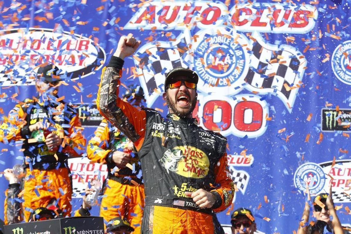 Defending NASCAR Cup Series champion Martin Truex Jr. (78) celebrates after winning Sunday’s Auto Club 400 race at Auto Club Speedway in Fontana, Calif.