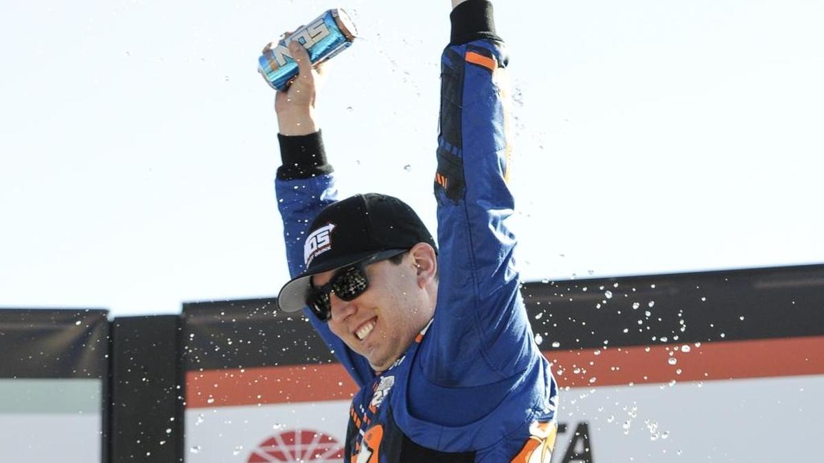 Kyle Busch celebrates after winning Saturday’s NASCAR XFinity Series auto race at Atlanta Motor Speedway.