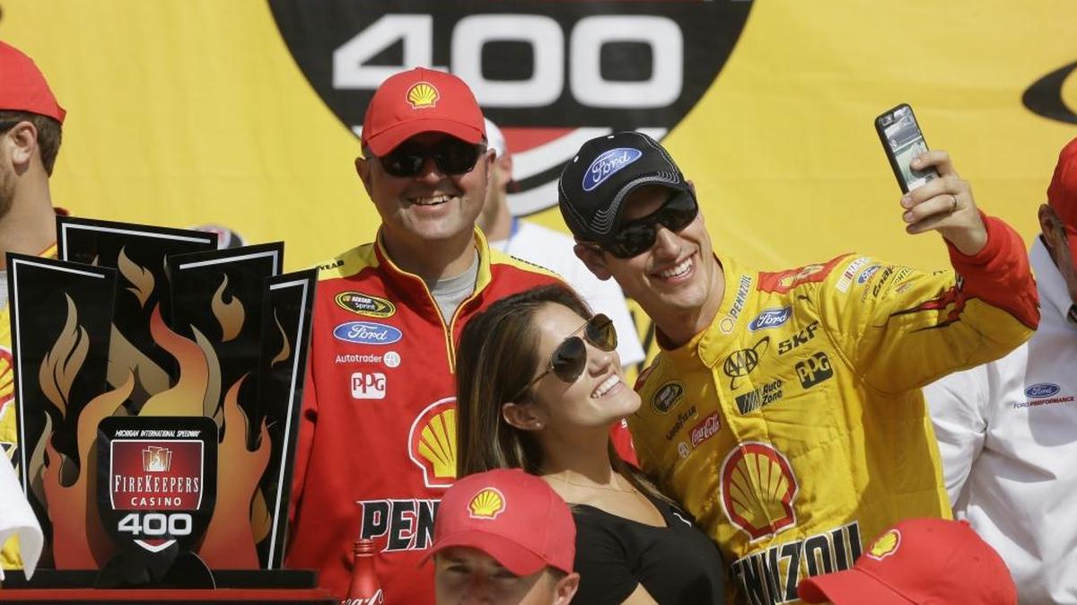 Joey Logano takes a selfie with his wife, Brittany, after winning last year’s NASCAR Cup Series race at Michigan International Speedway. Sunday, Logano finished third but the couple had bigger news to reveal.
