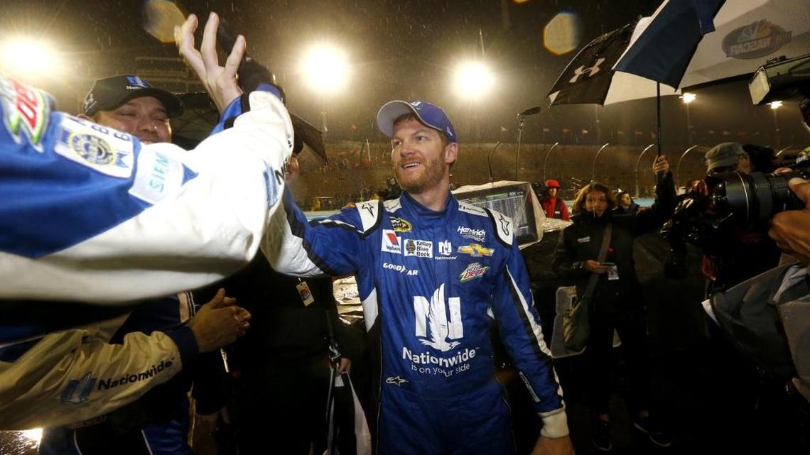 Dale Earnhardt Jr. celebrates on pit road after winning Sunday’s rain-shortened NASCAR Sprint Cup Series Quicken Loans Race for Heroes 500 at Phoenix International Raceway.