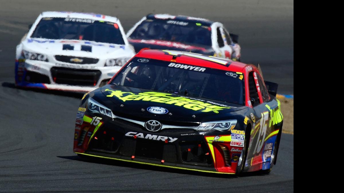 
Clint Bowyer, driver of the #15 5-Hour Energy Toyota, leads a pack of cars during the NASCAR Sprint Cup Series Toyota/Save Mart 350 at Sonoma Raceway on June 28, 2015 in Sonoma, California. 
