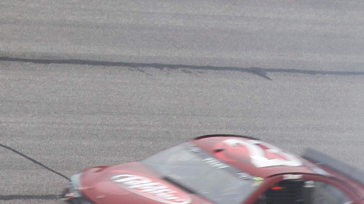 Austin Dillon (3) slides into the grass as J.J. Yeley (23) and Brian Scott (33) pass behind during the NASCAR Sprint Cup series auto race at Atlanta Motor Speedway, Sunday, March 1, 2015, in Hampton, Ga.
