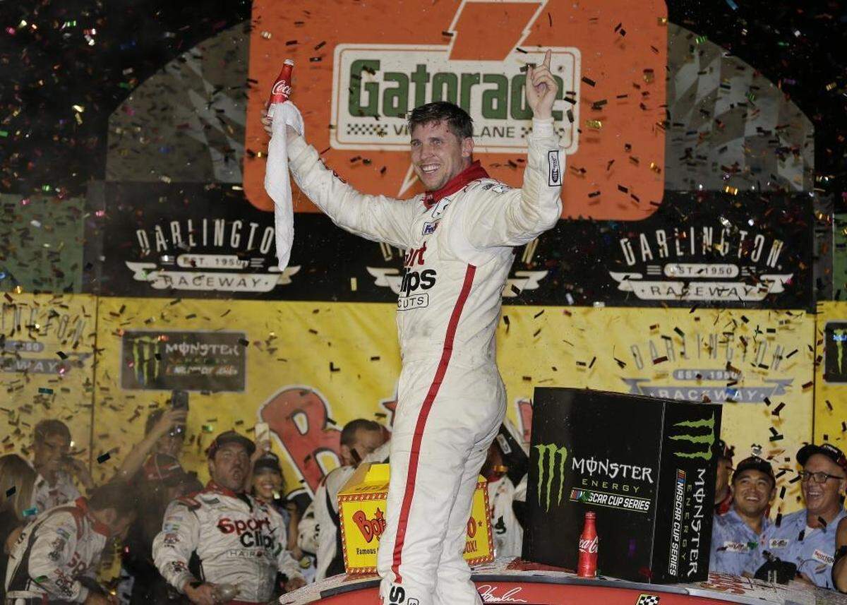 Denny Hamlin celebrates in Victory Lane after winning Sunday’s NASCAR Monster Cup auto race – Bojangles’ Southern 500 – at Darlington Raceway in Darlington, S.C.