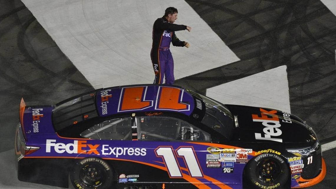 Denny Hamlin celebrates his win in the NASCAR Sprint All-Star Race at Charlotte Motor Speedway on May 16, 2015.